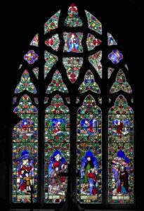 Victorian stained glass window designed by Henry Holiday
